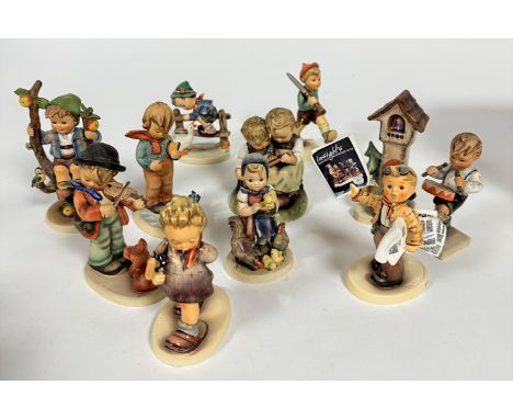 A collection of eleven Hummel figures including, The Professor, Extra, Extra, On Parade, Apple Tree Boy, etc. (tallest: 15cm)