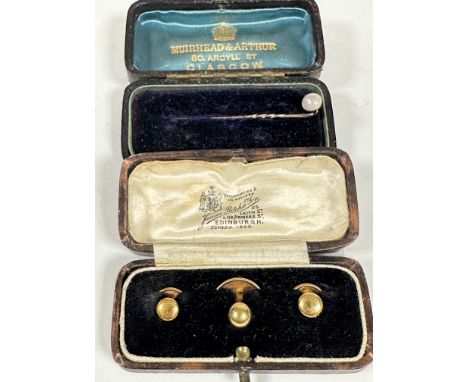 A set of three 18ct gold plain dress studs in original fitted box, 3.05g and a yellow metal pearl set stick pin in original f