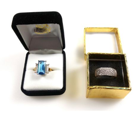 9ct gold ring set large baguette-cut light blue stone flanked by baguette-cut white stones, size O½, stamped 9K &amp; 375, 4.