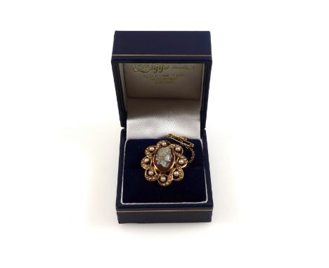 Late 19th century Continental yellow metal openwork octafoil brooch set seed pearls and centred by a shell cameo portrait sta
