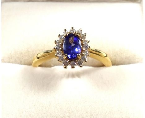 18ct gold ring set tanzanite and diamonds, size O, stamped 18K &amp; 750, 3.9 grams, boxed 