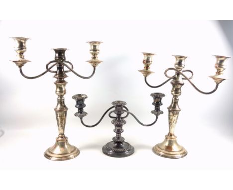 2 silver plated 3 light candelabra, each with 2 reeded scroll branches, on a tapering column, stepped circular base, 41.5 and