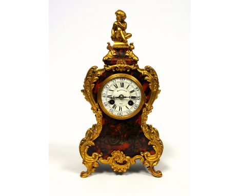 Early 20th century Louis XV style mantel clock with a circular enamel dial inscribed Maple &amp; Co. Ltd., Paris, enclosing a