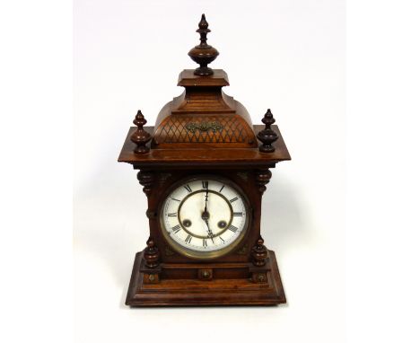 Brass ship's barometer with a silvered circular dial enclosing an aneroid movement, on a mahogany base, Dia.27.7cm; German ma