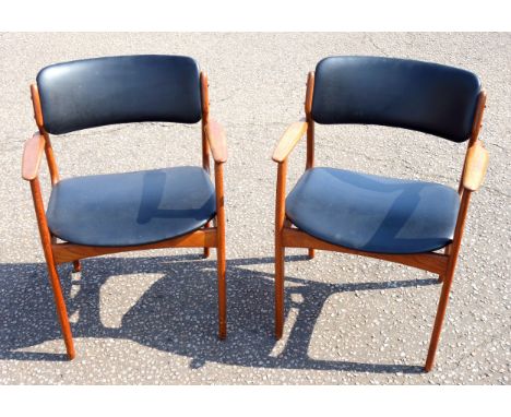 Pair of Danish Erik Buch Model 50 teak dining chairs with open arms and upholstered in black vinyl. (2) 