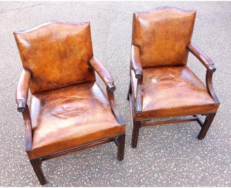 Pair of George III style mahogany open armchairs, each with down swept arms, on moulded chamfered legs joined by stretchers, 