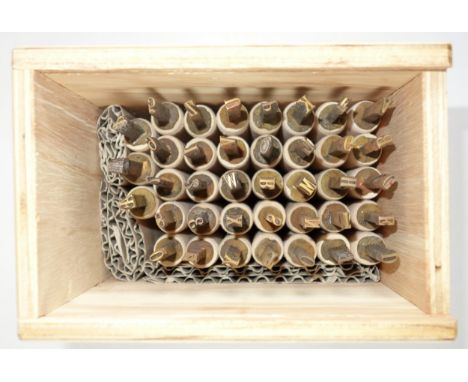Wooden box containing 38 gold finishing hand tools comprising complete alphabet,  numbers 0-9, ampersand, and 2 AE, (Elizabet