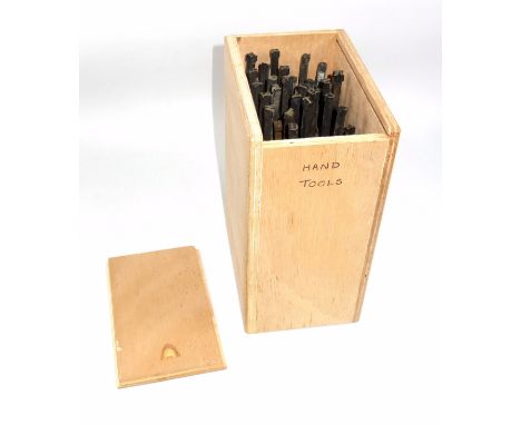33 gold finishing hand tools comprising complete alphabet, numbers 2, 3, 5-9 , and ampersand, (unknown font and size). (33) 