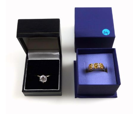 14ct gold ring set single white stone, size N, stamped 585, 2.8 grams; 9ct gold ring with orange sapphires and illusion set d