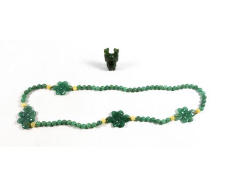 Chinese jade bead and pierced crossover plaque necklace, L.70cm approx., beads Dia.8mm, and a carved jade figure, H.5.1cm. (2