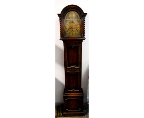 George V longcase clock with an arched brass dial inscribed "Tempus Fugit" enclosing a German 8 day 3 train movement, by Wint