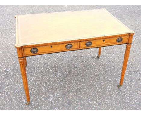 Good English reproduction of a Louis XVI satinwood writing table, the gilt tooled leather inset top with crossbanding and pro