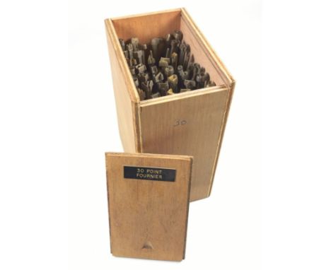 Wooden box containing 40 gold finishing hand tools comprising complete alphabet, numbers 0-9, ampersand, AE, OE, comma and po