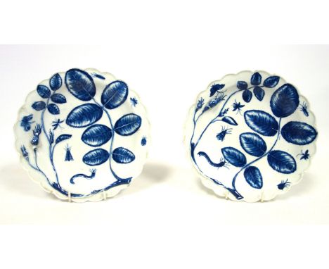 Pair of Worcester First Period circular plates, each with painted blue and white rose buds, leaves, and insect decoration in 