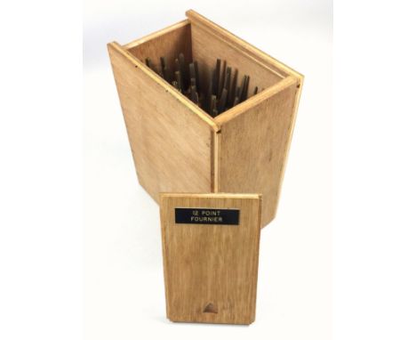 Wooden box containing 40 gold finishing hand tools comprising complete alphabet, numbers 0-9, ampersand, AE, OE, comma and po