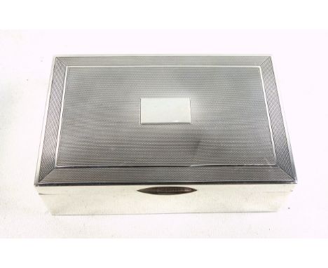 Silver rectangular cigarette box, the engine turned hinged cover with vacant cartouche, by J R, Birmingham, 1972, 4.5 x 13.7 