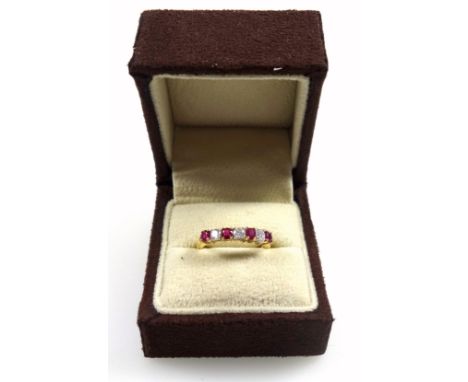 18ct gold ring set rubies (0.2ct), and diamonds (0.2ct), size L¼, stamped 18ct &amp; 750, 3.0 grams, boxed 