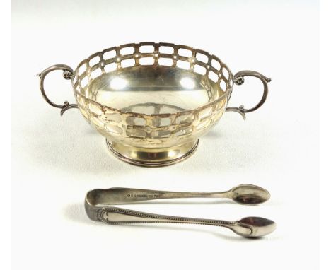 Edwardian silver circular bowl with pierced square and canted rectangular decoration, 2 twin scroll handles on a circular foo