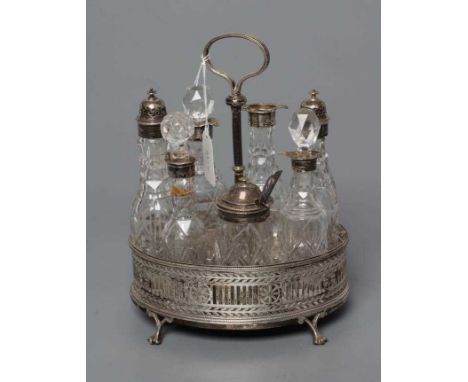 A VICTORIAN SILVER SEVEN BOTTLE CRUET AND OVAL STAND, by Henry Wilkinson &amp; Sons Ltd., Sheffield 1868, with applied bead c
