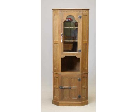 A DAVID LANGSTAFF ADZED OAK CORNER CUPBOARD, the moulded cornice and half penny moulded frieze over arched glazed door with s