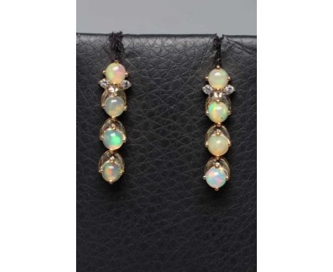 A PAIR OF OPAL DROP EAR STUDS, the four circular cabochon polished stones claw set to a fixed 9ct gold frame, the top stone w