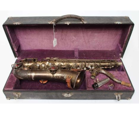 A BUESCHER SILVER PLATED SAXOPHONE, C-Melody, marked Low Pitch, with True-Tone logo and reg. no. 96886, cased (Est. plus 24% 