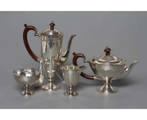 A SMALL FOUR PIECE TEA AND COFFEE SERVICE, by E.S. Barnsley &amp; Co., Birmingham 1921, of panelled flared form with castella