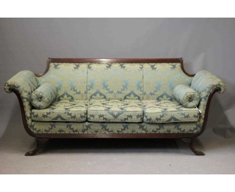 A REGENCY MAHOGANY SHOW FRAME SOFA, early 19th century, upholstered in blue silk damask, arched back, scrolled arms applied w