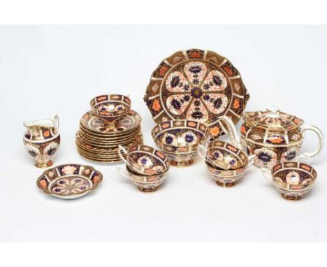 A ROYAL CROWN DERBY CHINA TEA SERVICE, c.1935, painted in the Imari pattern number 9021, comprising six each cups, saucers an