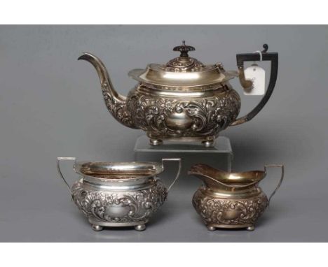 A LATE VICTORIAN SILVER THREE PIECE TEA SERVICE, possibly by Charles Horner, Birmingham 1899, of plain rounded oblong baluste