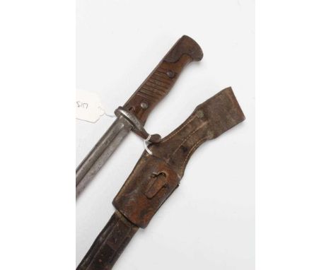 A GERMAN M1889 BAYONET with 20 1/4" pipe back blade, maker's mark for G.G. Haenel, hilt inscribed "22R 12 133", leather scabb