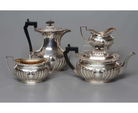 AN EDWARDIAN SILVER FOUR PIECE TEA AND COFFEE SERVICE, by John Round &amp; Son, Sheffield 1902, of semi-wrythen fluted oblong