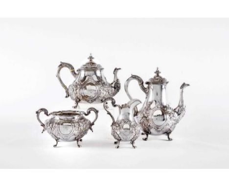 A MID VICTORIAN SILVER FOUR PIECE TEA AND COFFEE SERVICE, by Daniel & Charles Houle, London 1865, of lobed baluster form rais