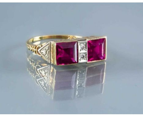 AN ART DECO RUBY RING, the two calibre cut stones collet set and flanking a central oblong panel gypsy set with two small dia