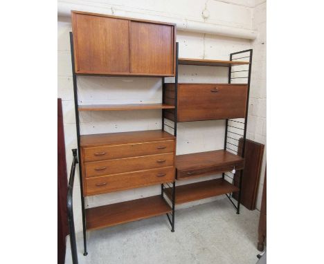 A LADDERAX TEAK MODULAR ROOM UNIT, c.1970's, on black painted metal supports, comprising a three drawer chest with wooden loo