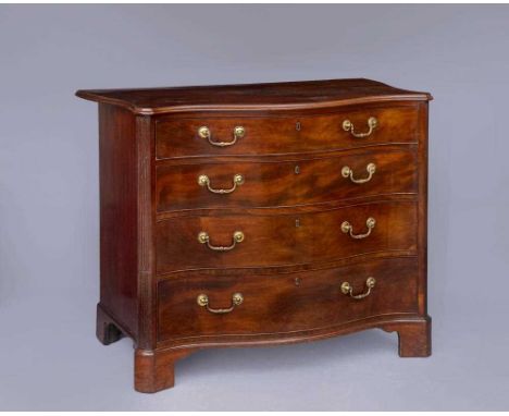 A GEORGIAN MAHOGANY SERPENTINE COMMODE CHEST, third quarter 18th century, the moulded edged top over fitted toilet drawer wit