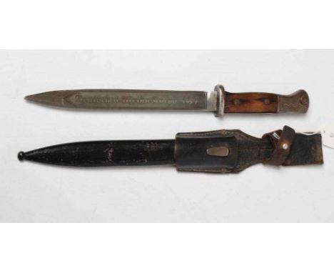 A GERMAN THIRD REICH K98N BAYONET, the 9 3/4" blade with etching for the Afrika Corps dated 1941, wood grip, etched pommel, s