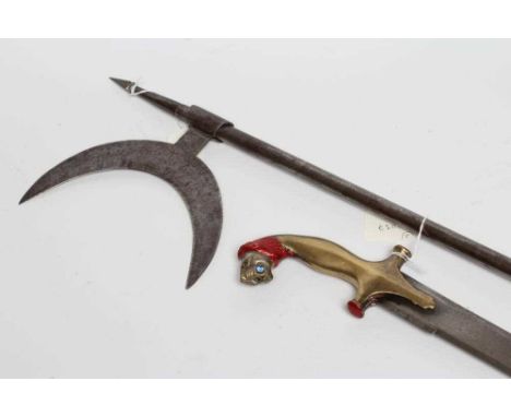 AN INDIAN KIRACH SWORD, the 31 3/4" blade curved at the tip, and brass hilt with lion head pommel, 36 1/4" long, together wit