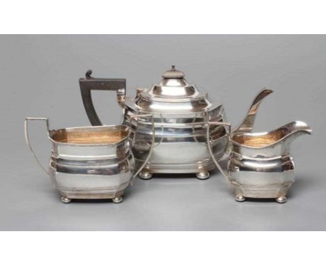 A THREE PIECE SILVER TEA SERVICE, by Nathan &amp; Hayes, Birmingham 1916 (teapot), and Chester 1916, of bombe rounded oblong 