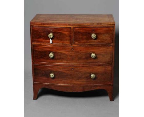 A REGENCY MAHOGANY BOWED CHEST, early 19th century, the banded caddy top with ebony stringing over two short and two long dra