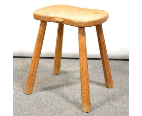 Arts &amp; Crafts oak saddle-seat stool, by Robert 'Mouseman' Thompson of Kilburn, waisted seat with carved signature mouse, 