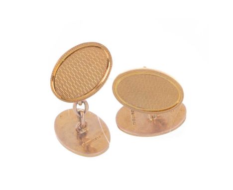 PAIR OF GOLD CUFFLINKS,  the oval panels with engine turned decoration, in nine carat goldQty: 10.1g