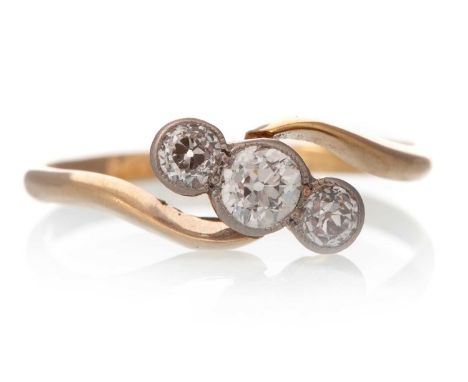 DIAMOND THREE STONE RING, the Old European cut diamonds totalling approximately 0.20 carats, marked 18K, size K 1/2Qty: 1.6g