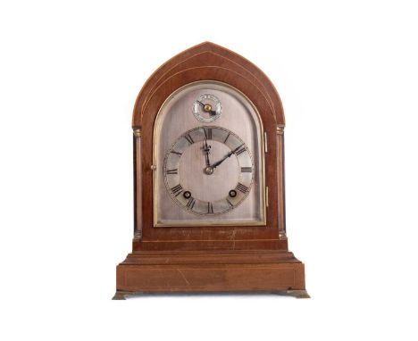 EDWARDIAN WALNUT MANTEL CLOCK EARLY 20TH CENTURY with two train eight day movement striking on a coil, with silvered Roman nu