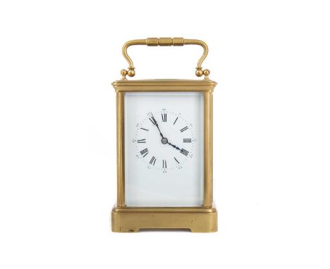 CARRIAGE CLOCK LATE 19TH/EARLY 20TH CENTURY with two train eight day movement striking on a coil, the white enamel dial with 