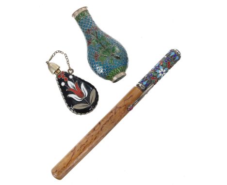 Russian silver and cloisonné enamelled scent bottle, with screw cover and of flask form with stylised flower on a black groun