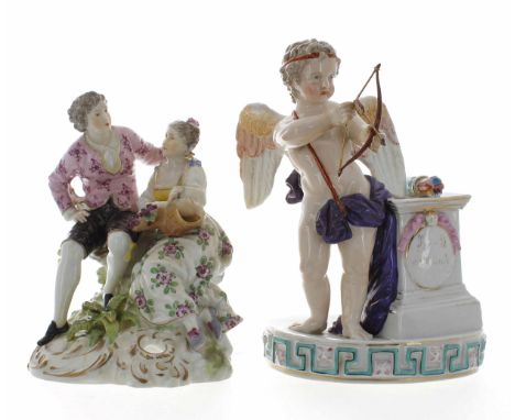 Rauenstein porcelain figural group of a courting couple, modelled seated on a tree trunk, upon a scrolling naturalistic base 