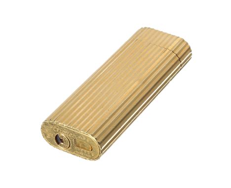 Cartier gold plated cigarette lighter, with a fluted body, Swiss made, marked to the underside, no. 59590L, 2.75" 