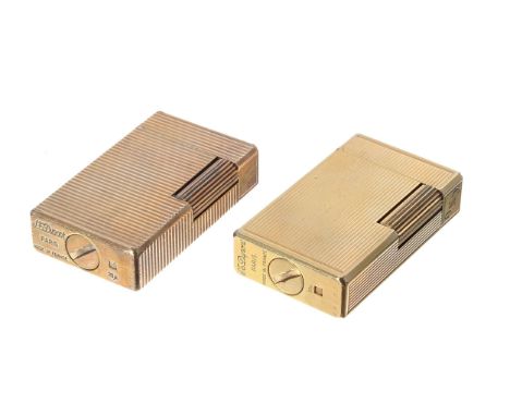S.T. Dupont gold plated cigarette lighter, with horizontal fluted body, made in France, 2.25"; together with another Dupont g