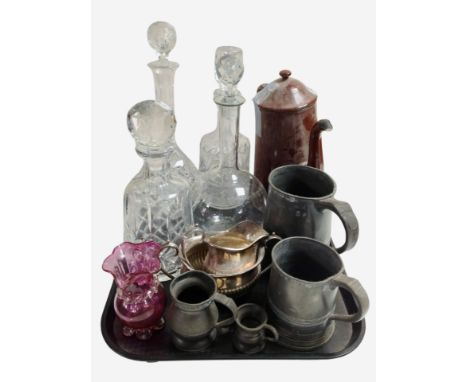 A group of crystal decanters, ruby glass vase, pewter tankards, silver-plated items.